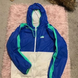 Used royal blue, green and white pink wind breaker
